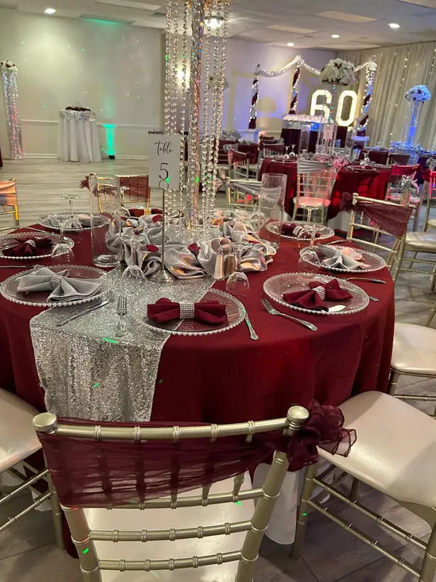 Burgundy linens with crystal centerpieces